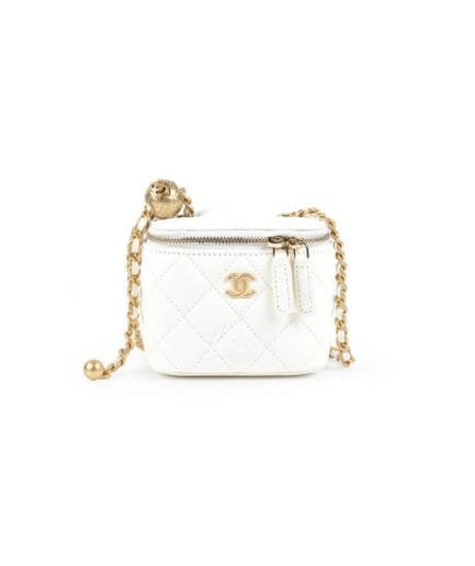 Chanel small gold ball makeup bag